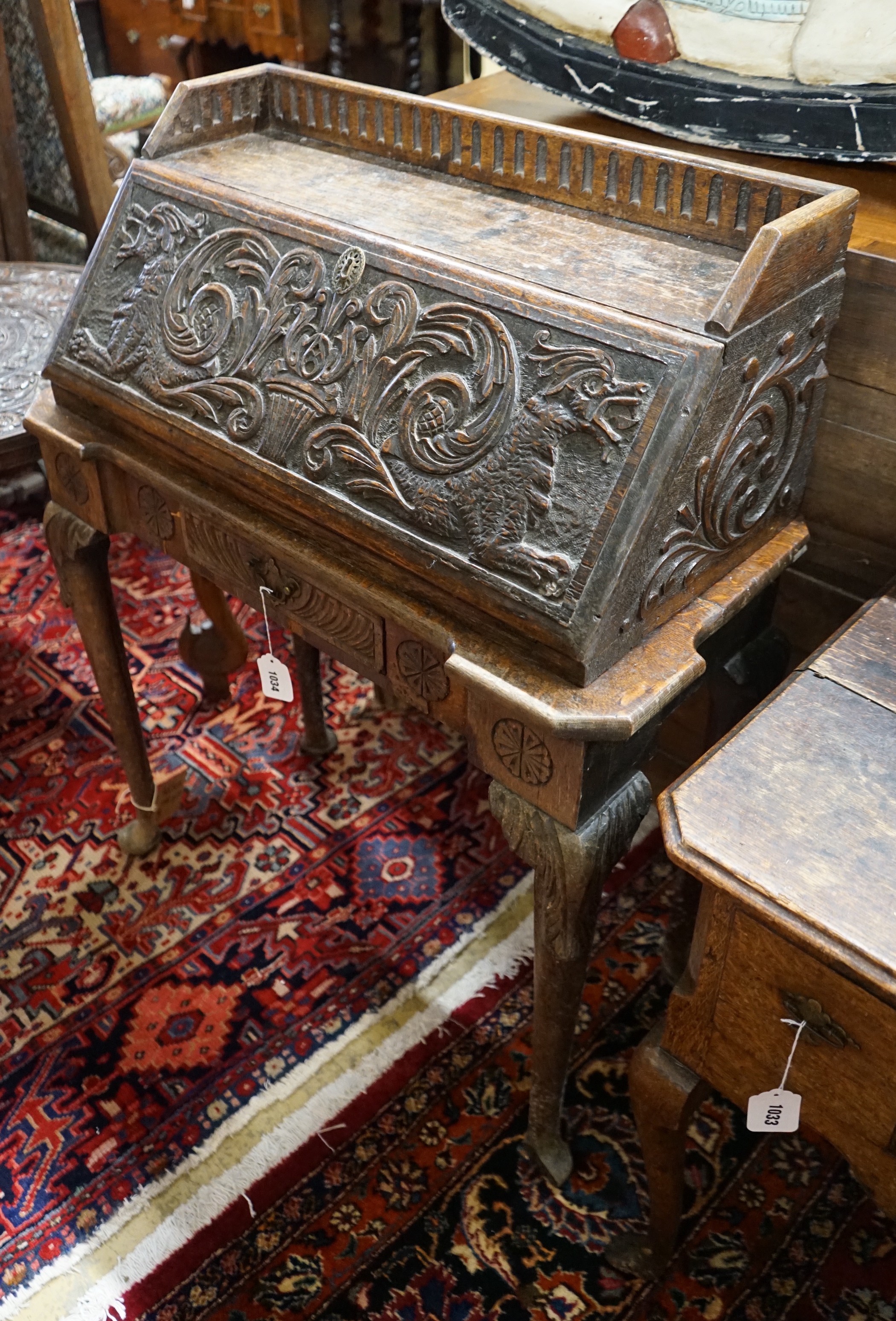 An 18th century style carved oak bureau, width 79cm, depth 36cm, height 99cm